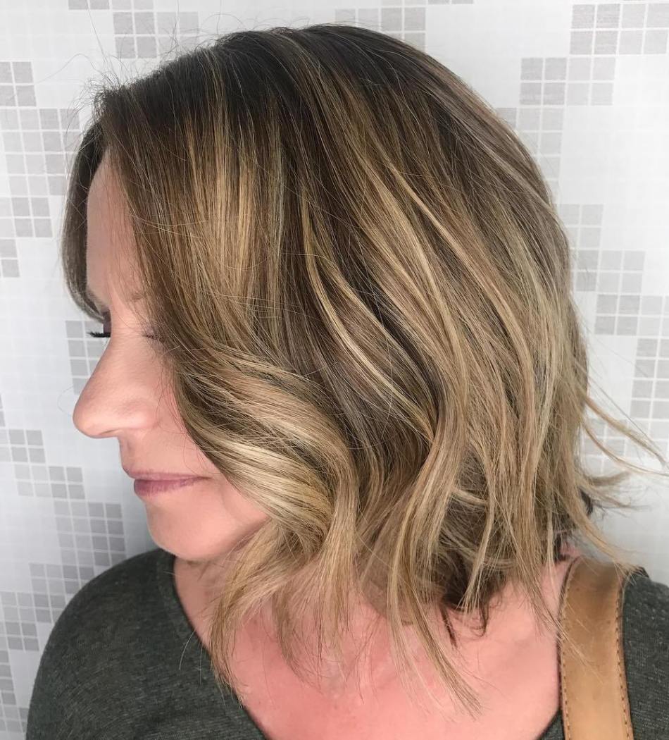 subtle curl in blonde highlighted hair