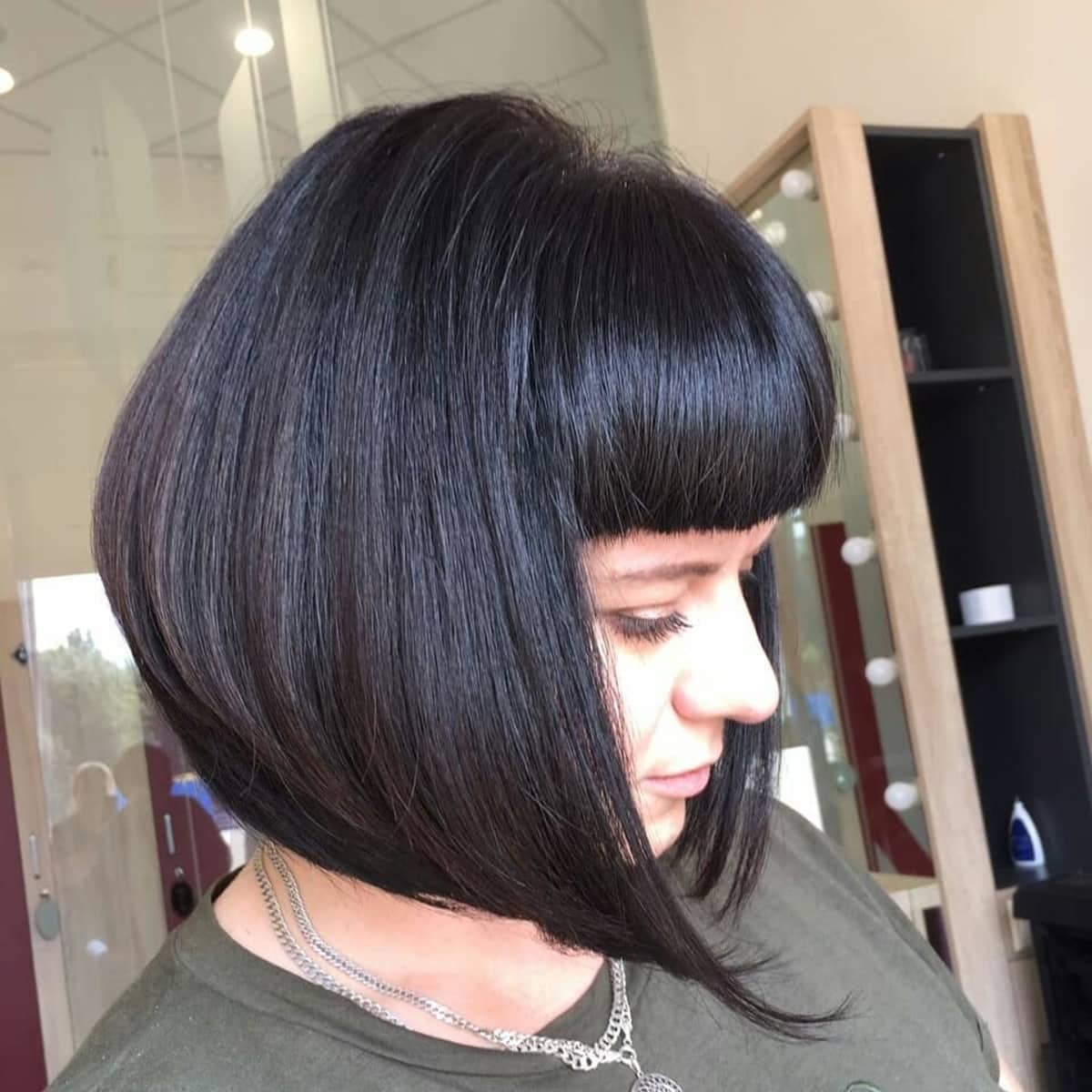 short stacked bob hairstyle with bangs