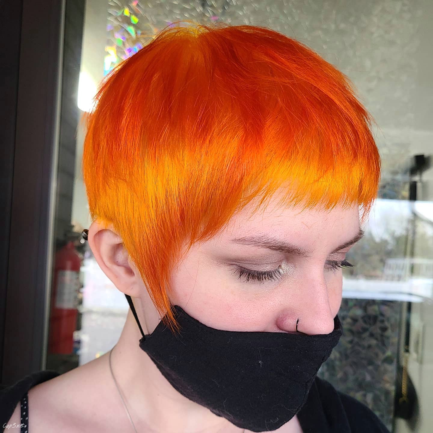 Bright Orange Pixie With Bangs