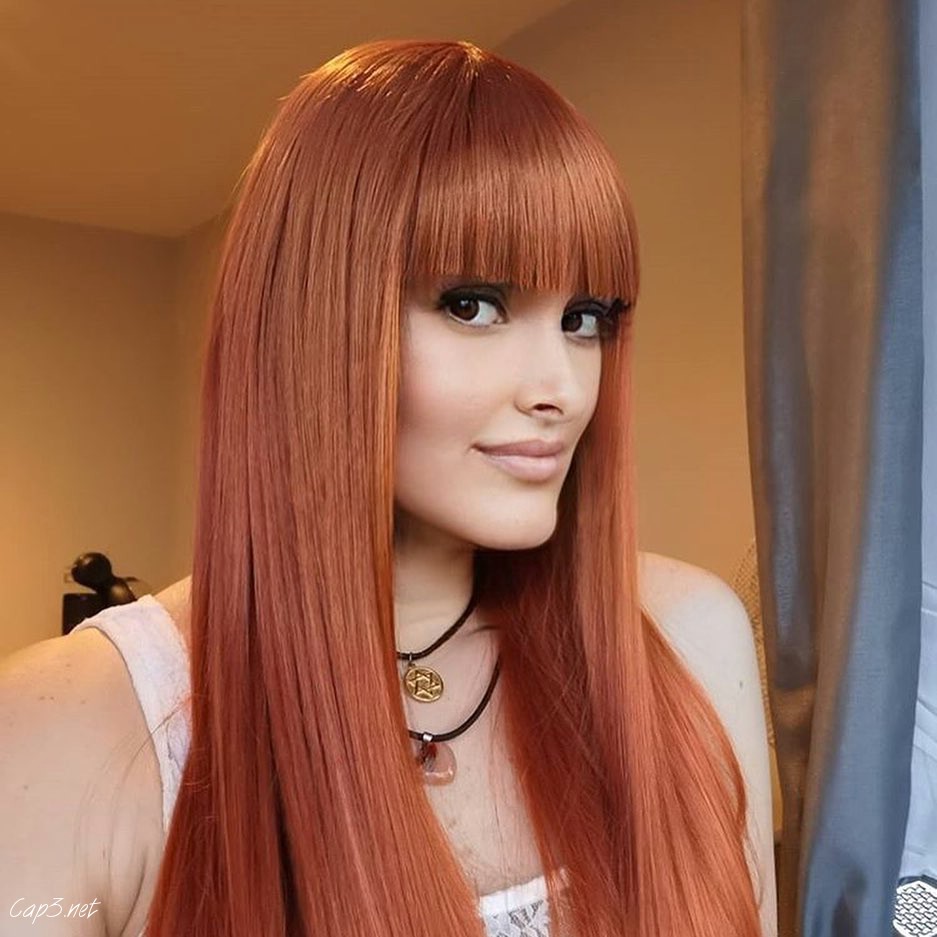 Orange Hair With Blunt Bangs For Oval Faces