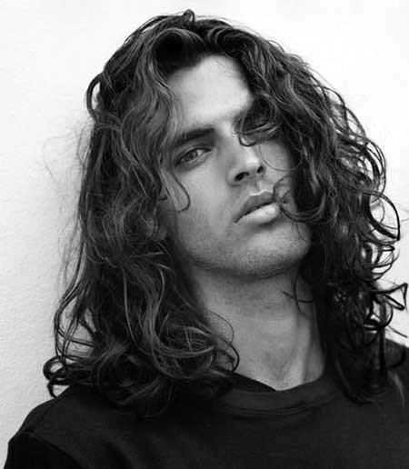 man with very long length curly hair