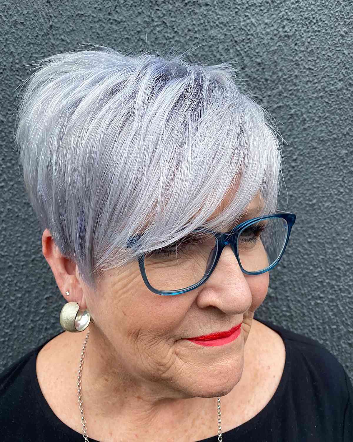 silver pixie with bangs for older women with glasses
