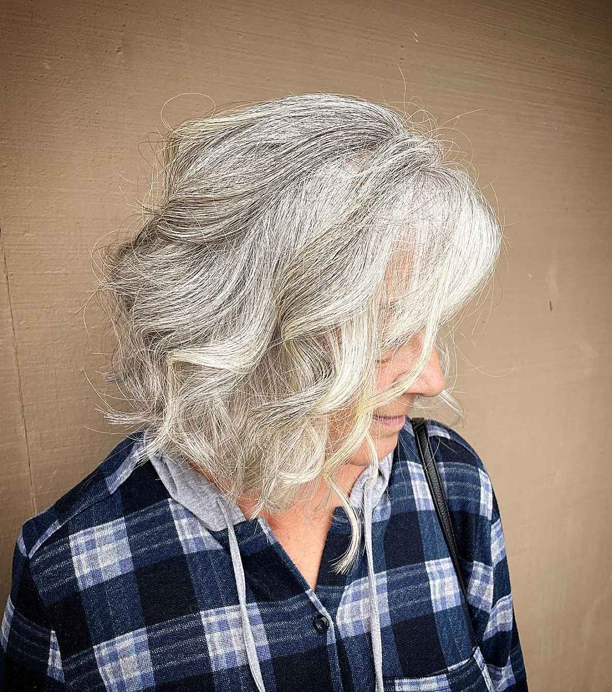 textured lob with soft curls for elderly women past sixty