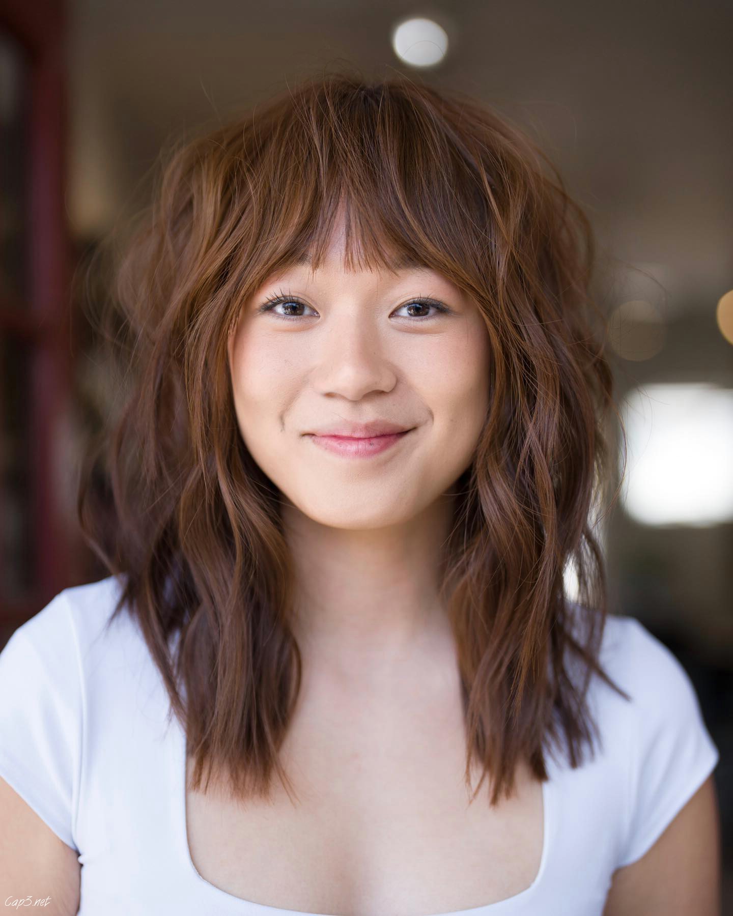 Light Brown Shaggy Cut With Bangs