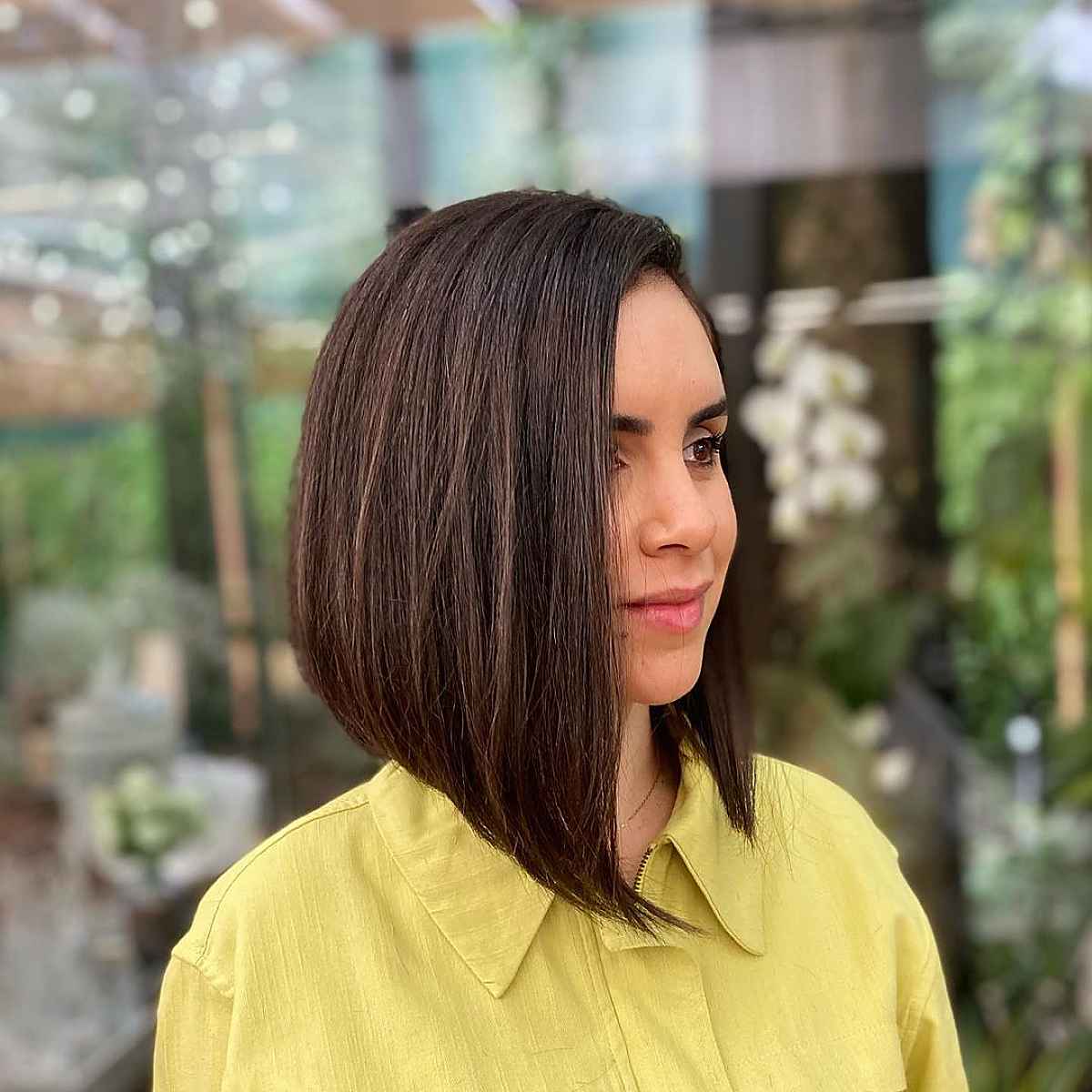 long bob haircut with a deep side part for women