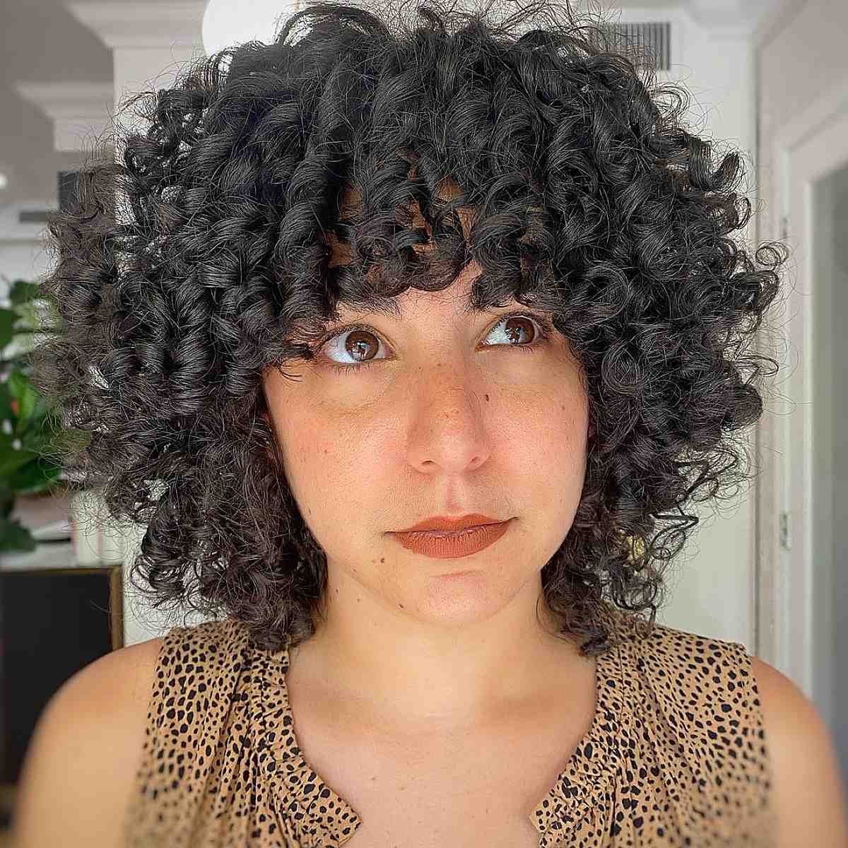 short curly bob with bangs hairstyle