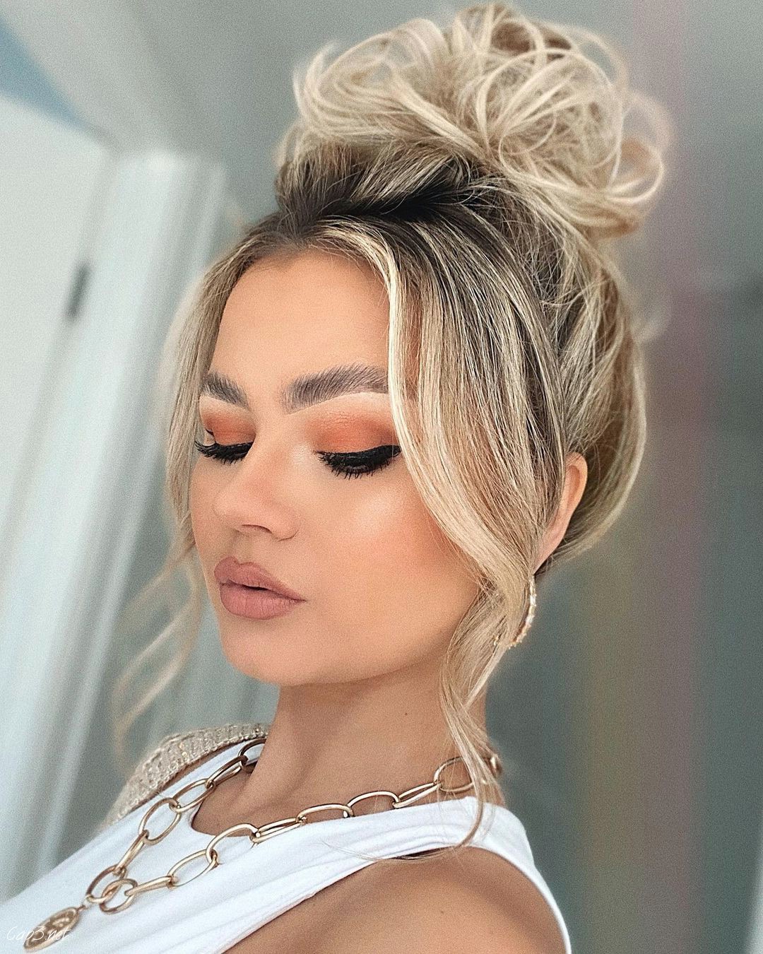 Gorgeous Messy Bun With Side Bangs