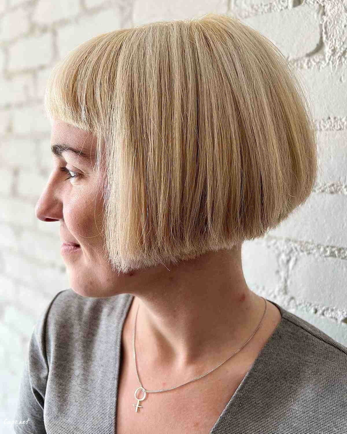 blonde jaw length bob with micro bangs