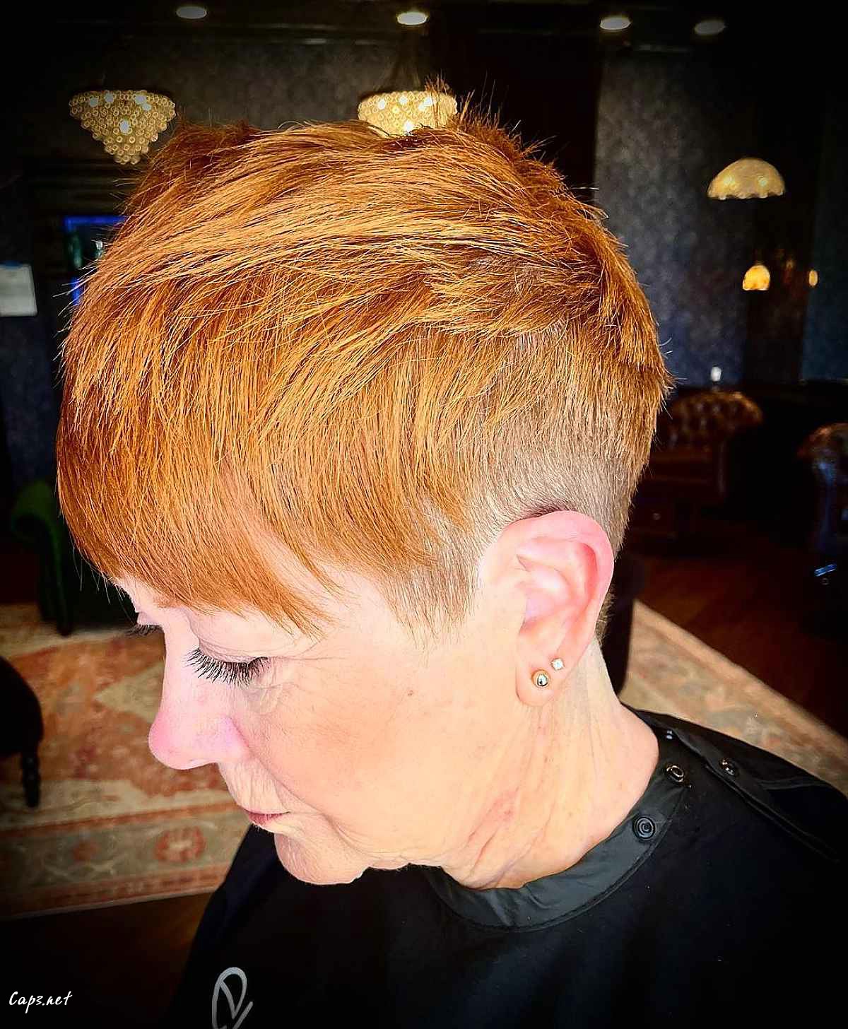 copper pixie hair with layers and bangs for women in their sixties