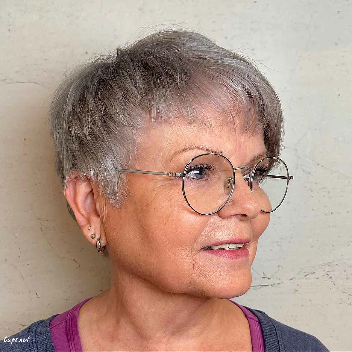 grey pixie hair with asymmetrical bangs for ladies over 60