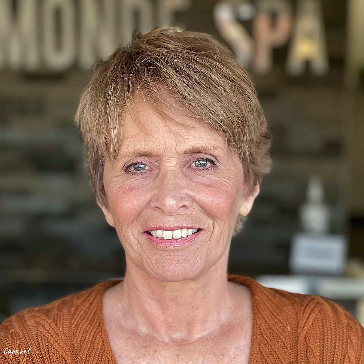 soft pixie haircut with side bangs on older women
