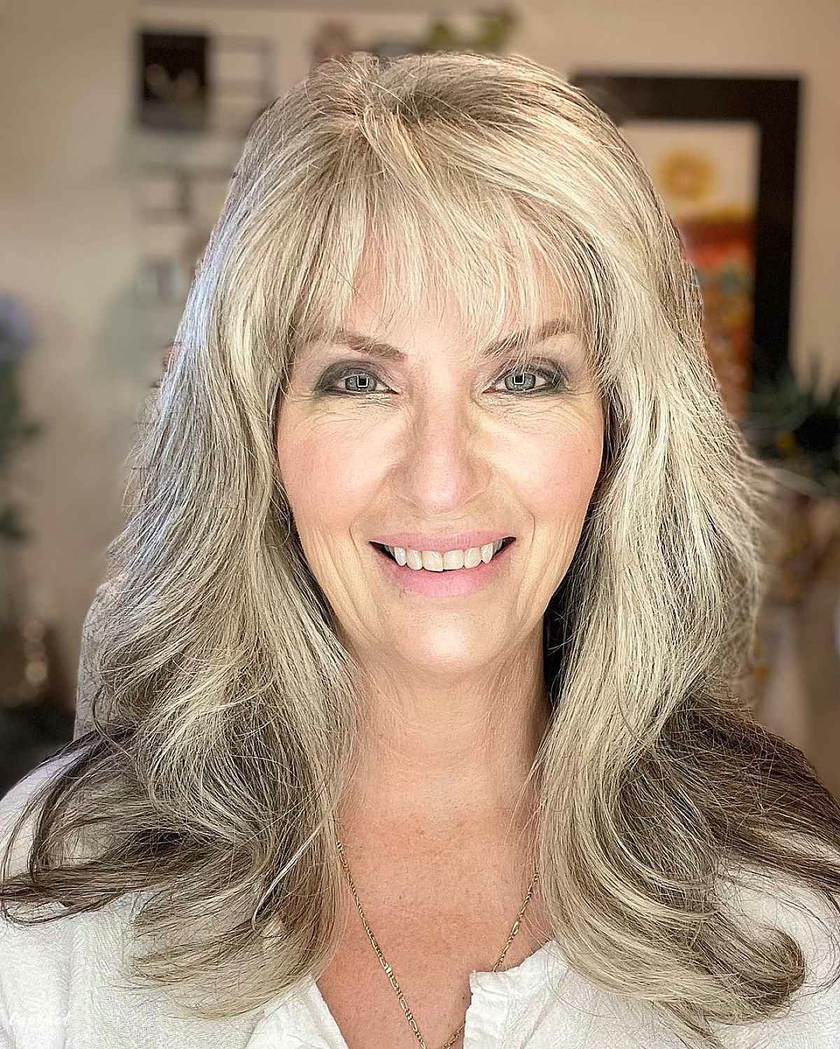 collarbone length hair with wispy bangs for ladies passed their sixties