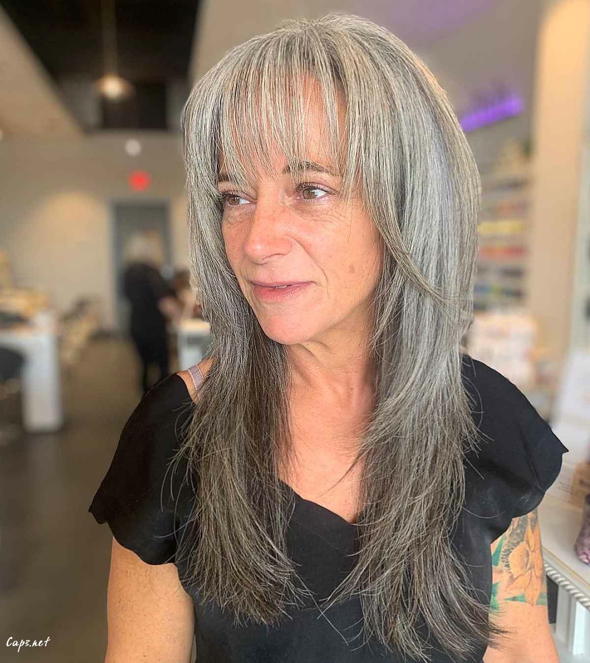 long shaggy hair with long bangs for ladies in their 60s