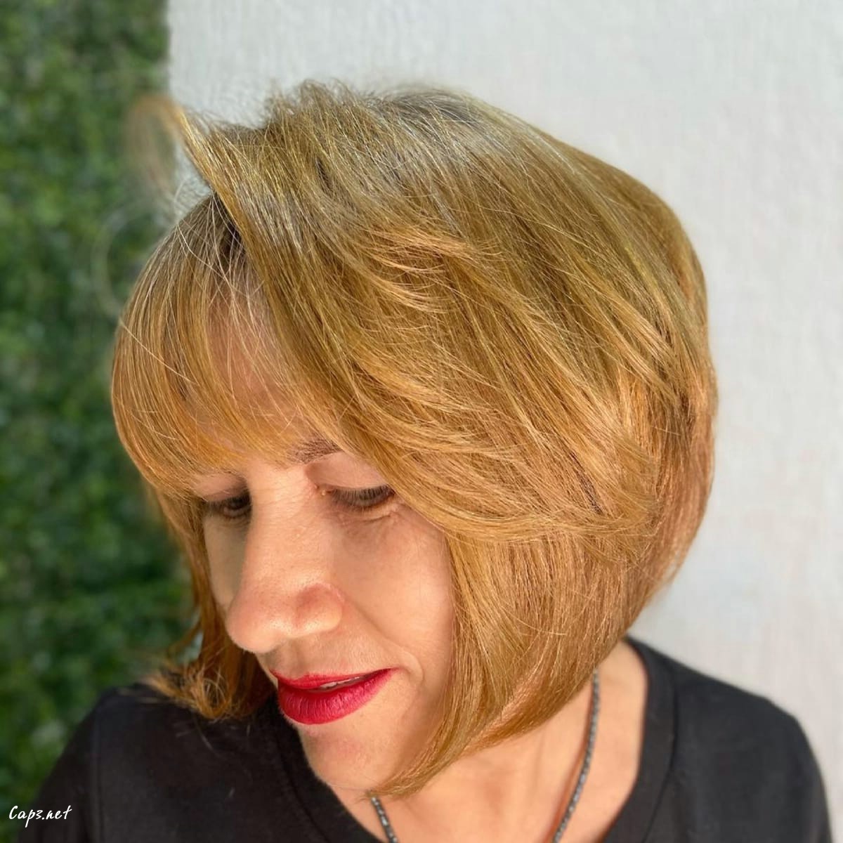 rounded bob with feathered layers for women over 60