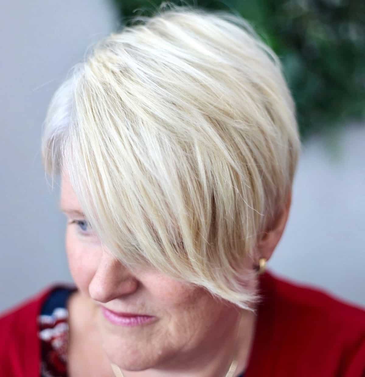 short cut with long side swept bangs for older women