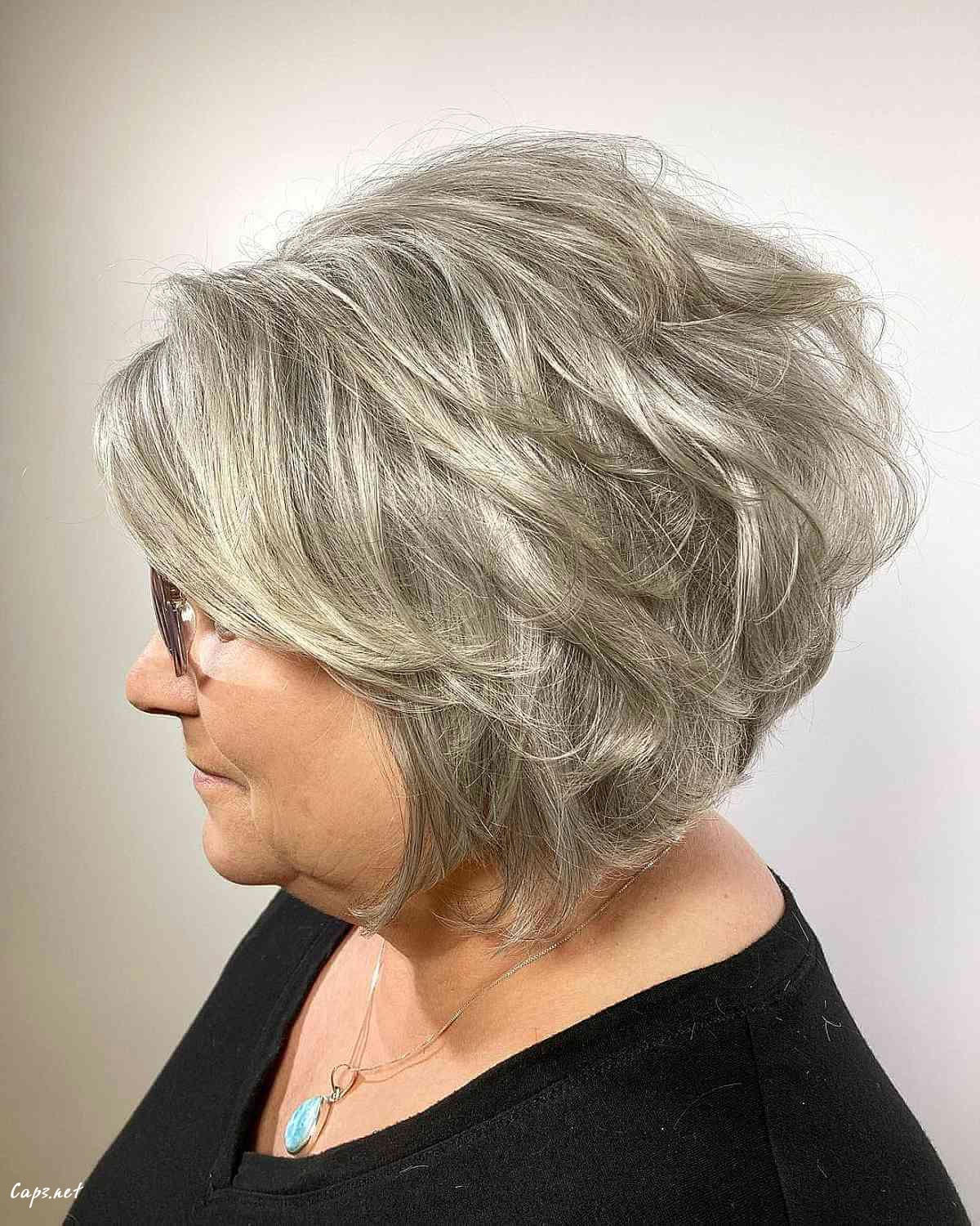 voluminous salt and pepper short bob for ladies over sixty with round faces