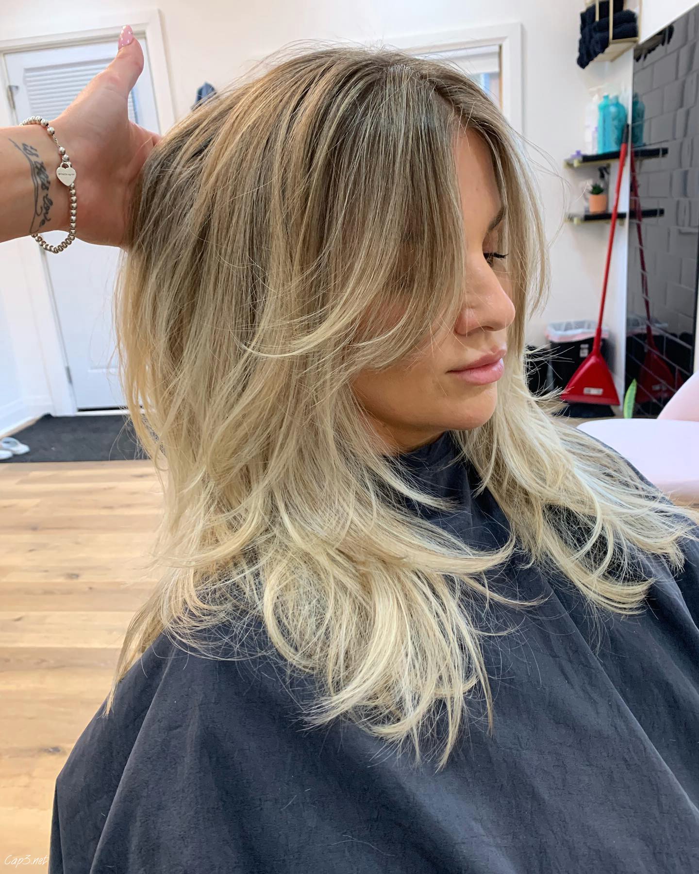 Blonde Wispy Haircut With Layers