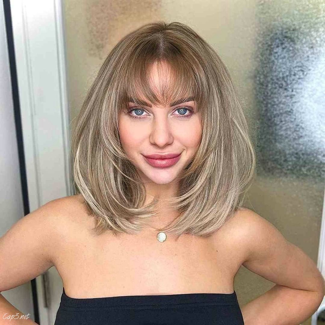 Blonde Wispy Layered Cut With Bangs