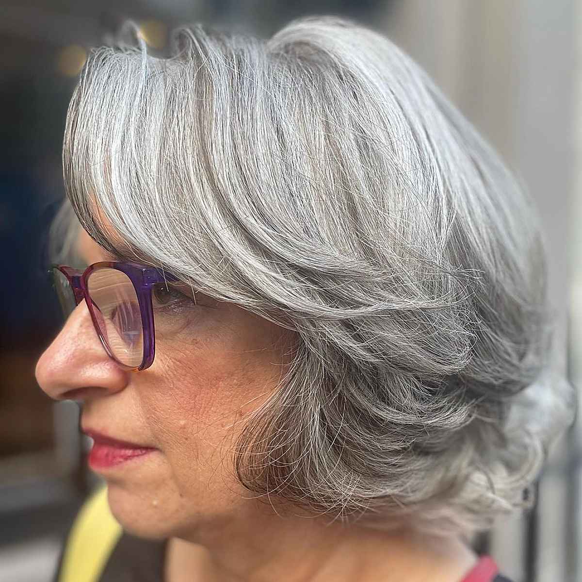 feathered bob with small frames for women over sixty