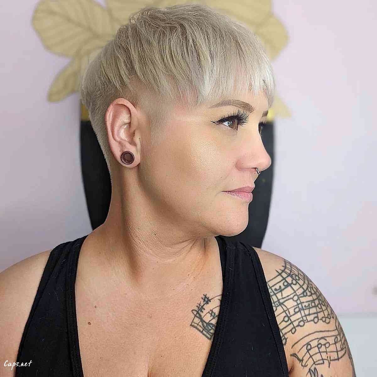 edgy short blonde pixie with an undercut