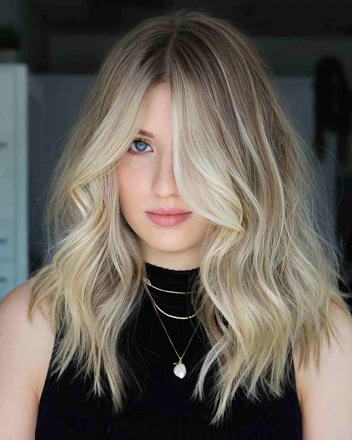 blonde long textured bob with a middle part