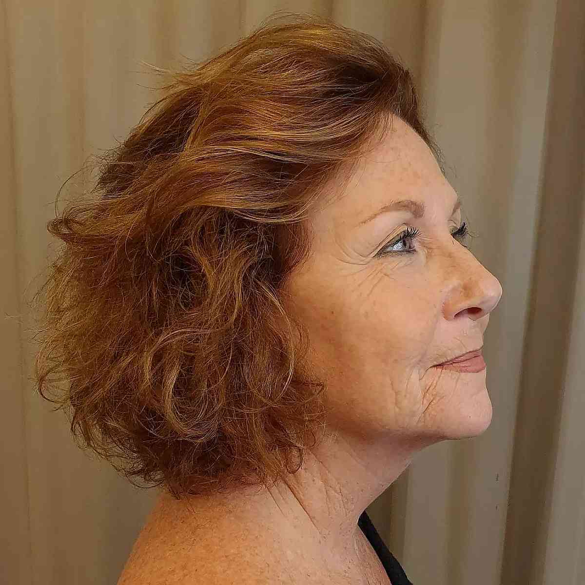 copper short bob with soft waves for a lady over 60