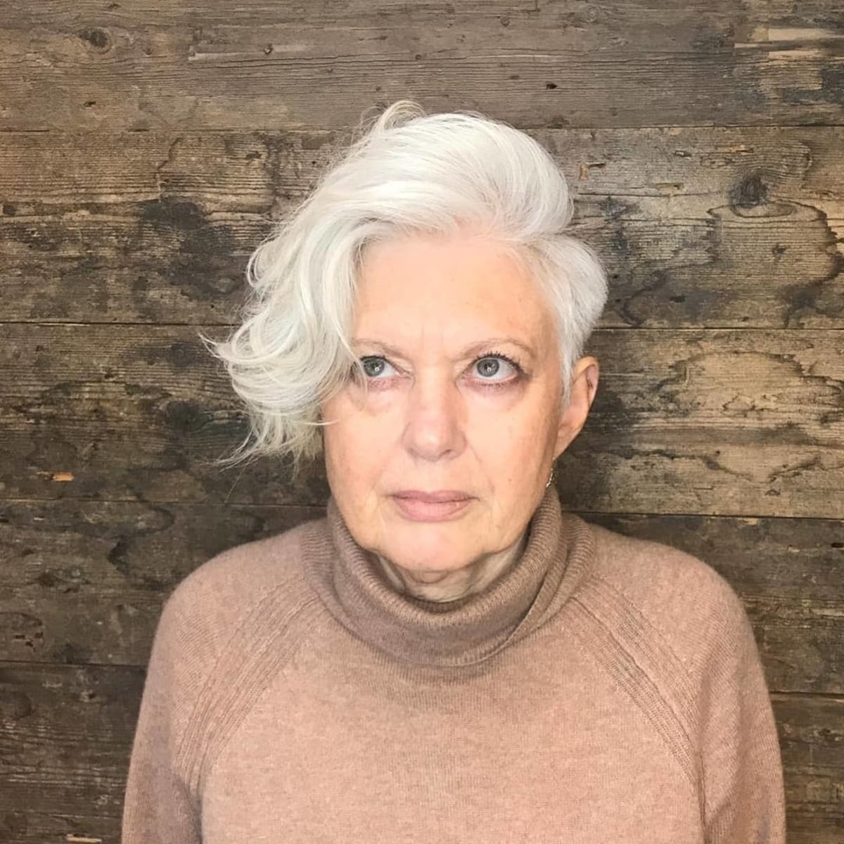 long asymmetrical pixie with a side part for women turning 60