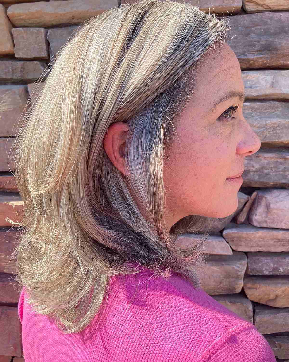 medium layered cut with flipped up ends for women over 40