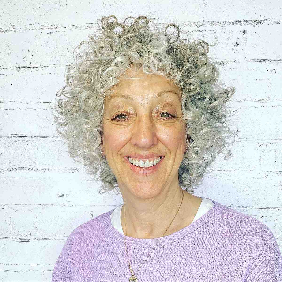 neck length cut with defined curls for women over 60
