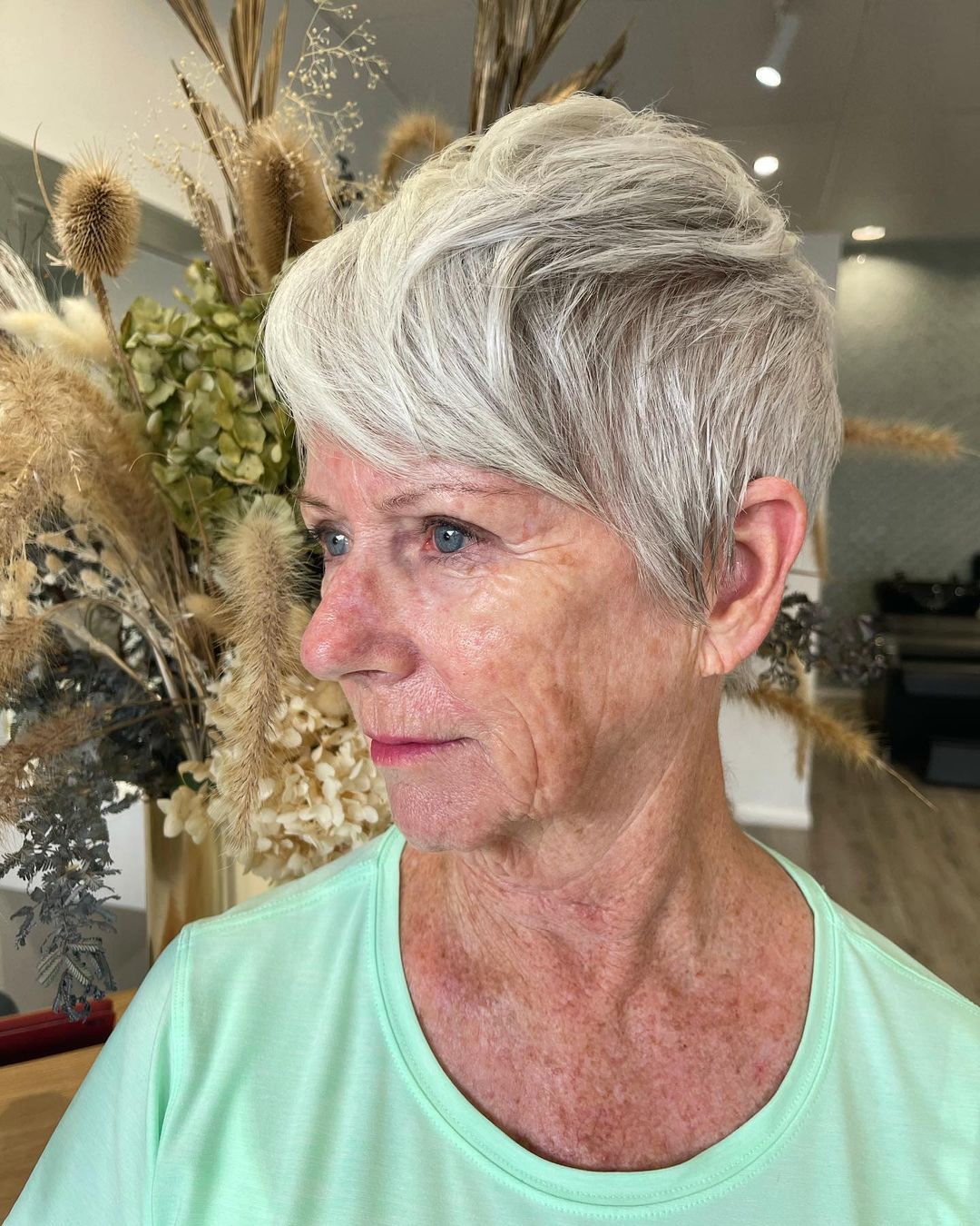 pixie cut with long side fringe for women in their 60s