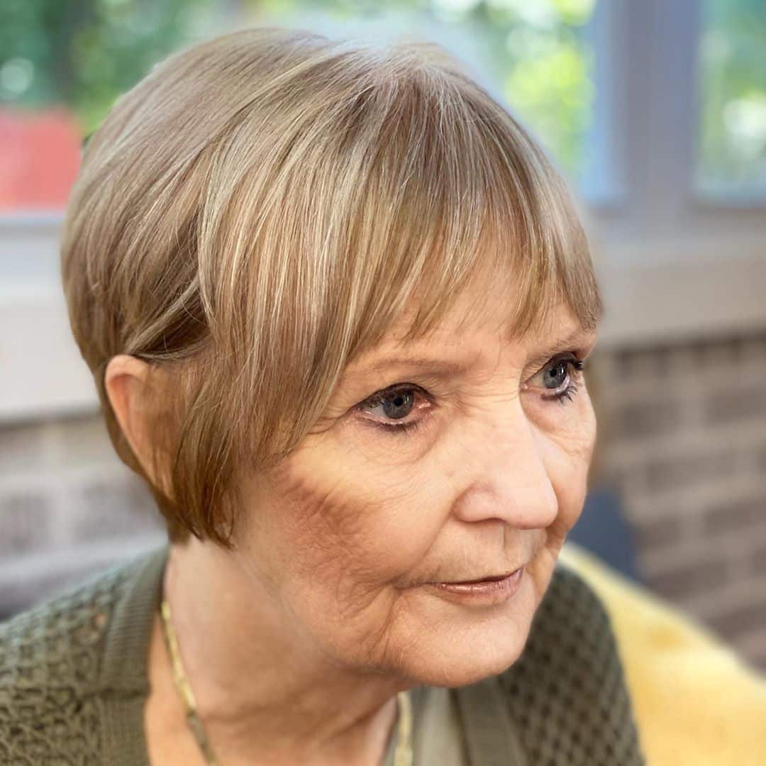 short hairstyle with wispy bangs for women over 60