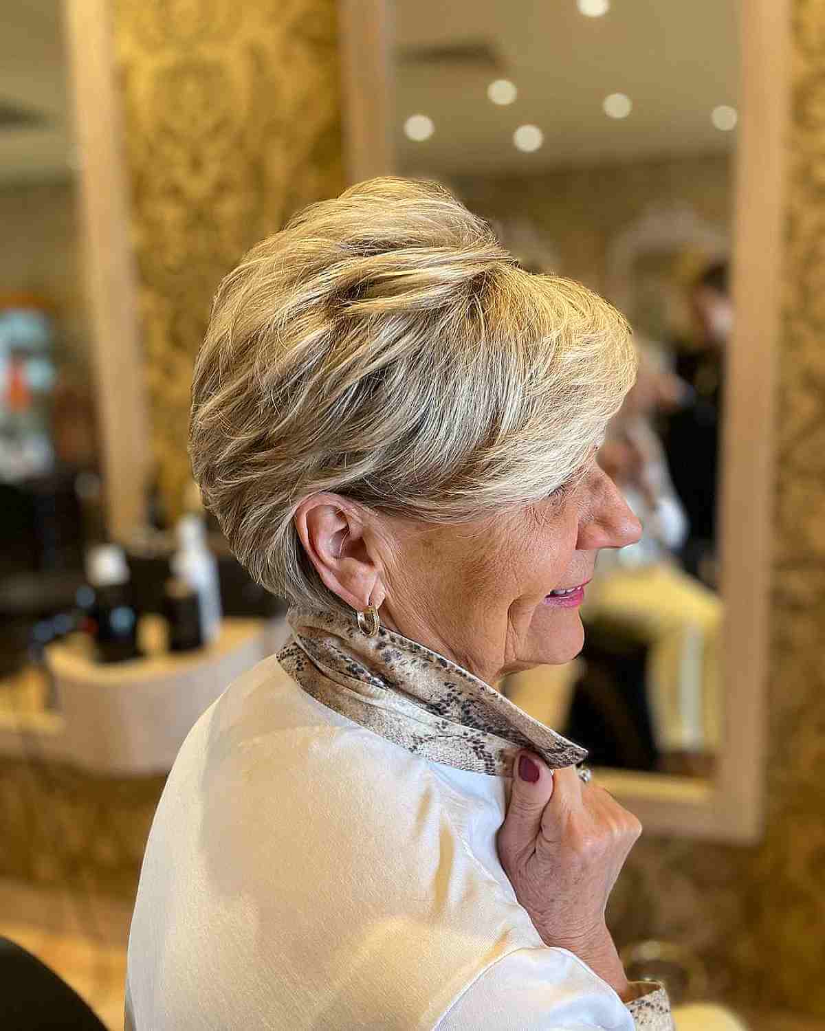 short long blonde pixie with shorter layers for women in their 60s