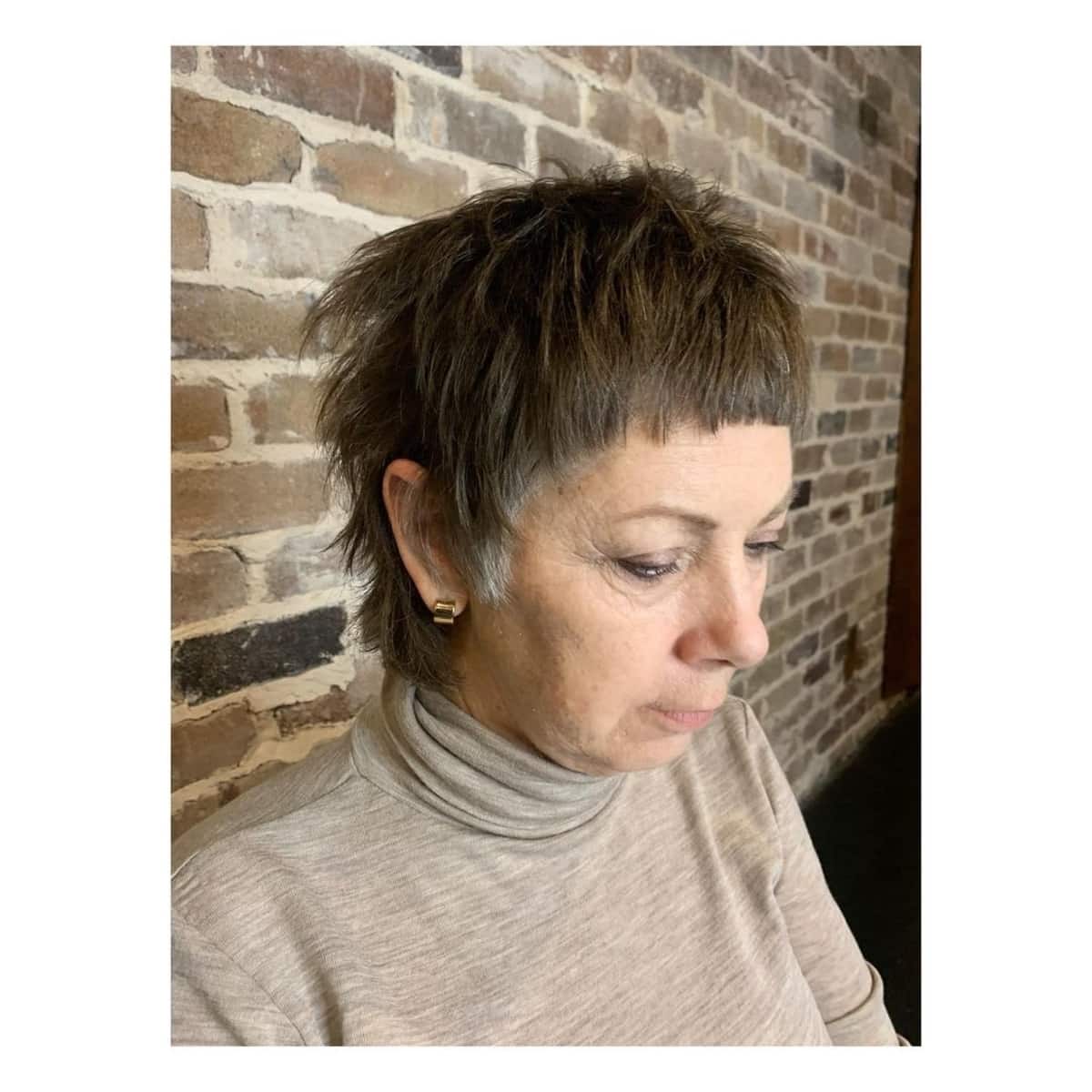 short shaggy haircut with bangs for 60 year old women