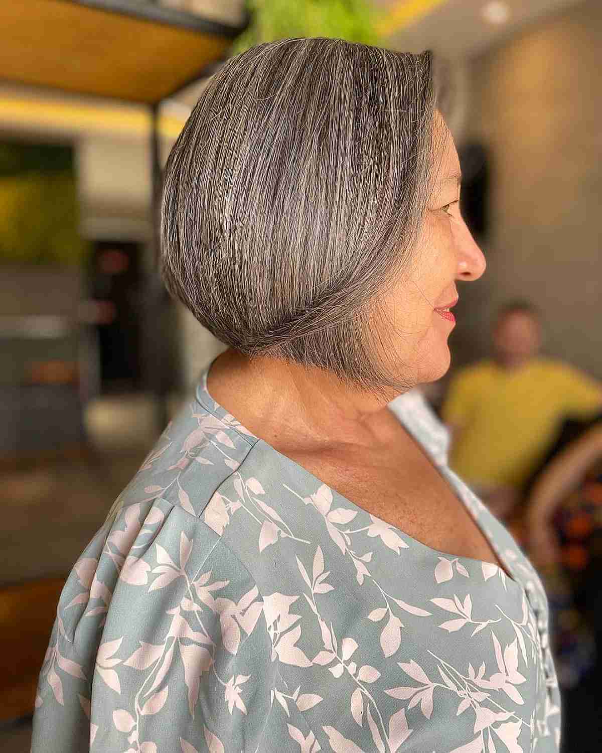 silver bob with long side bangs for women 60 and up