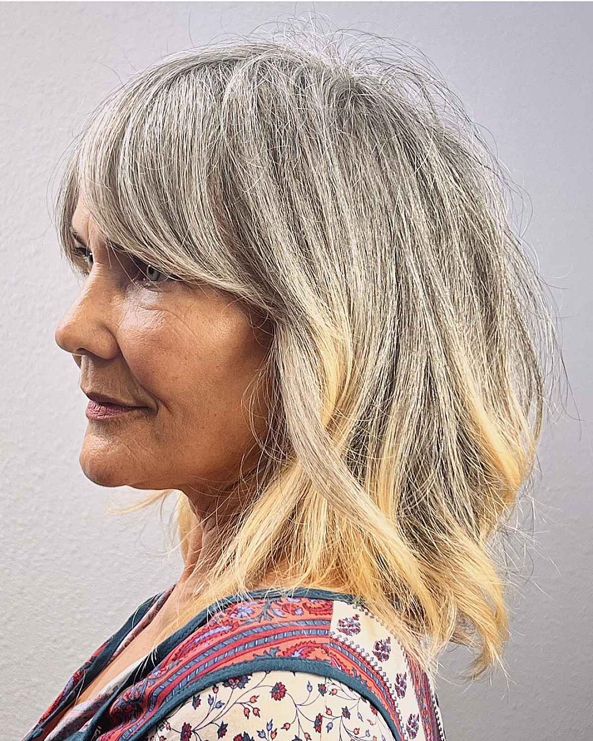 soft shaggy layers and curtain bangs for women past 60