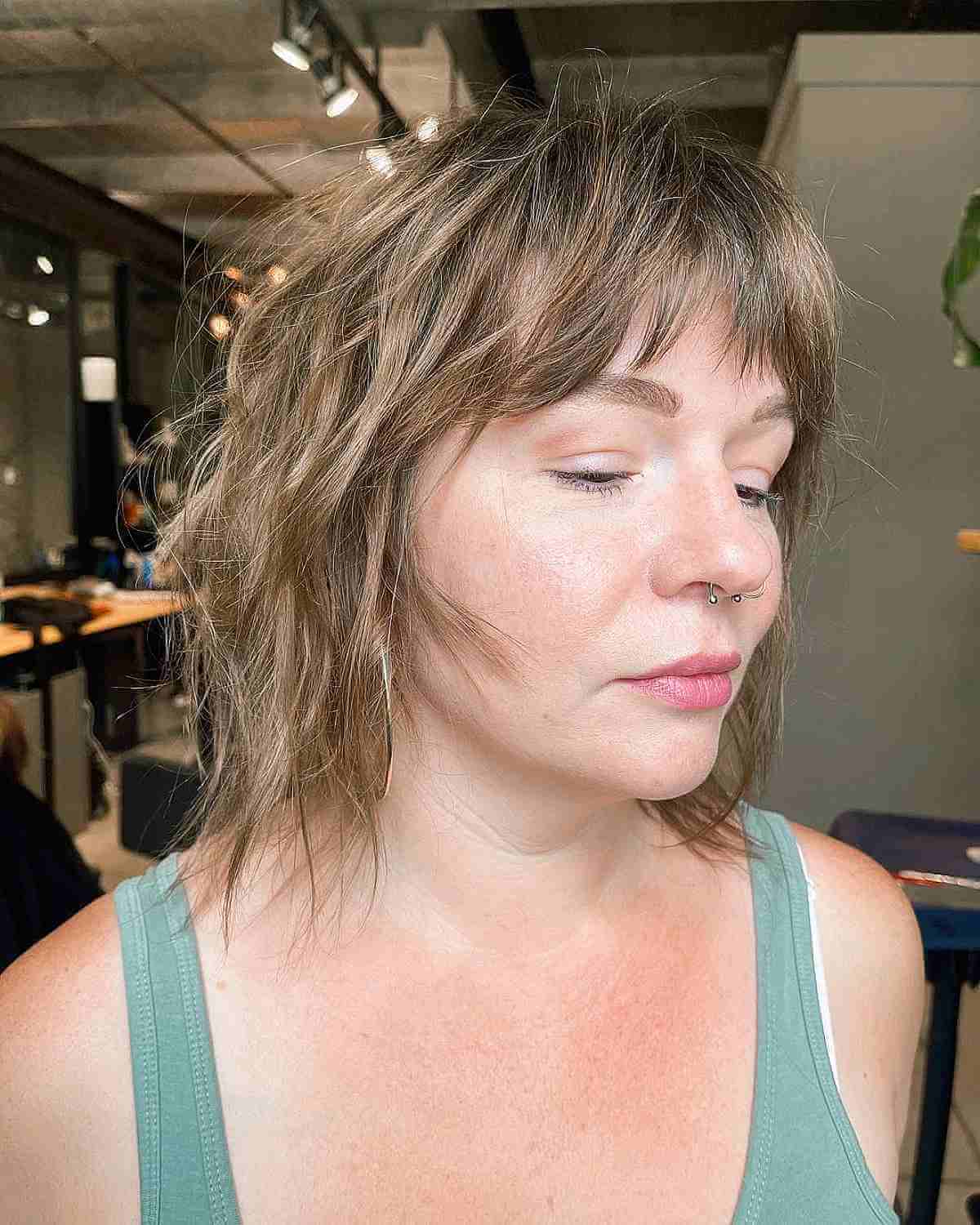 undone shaggy bob with short bangs for women at their 40s